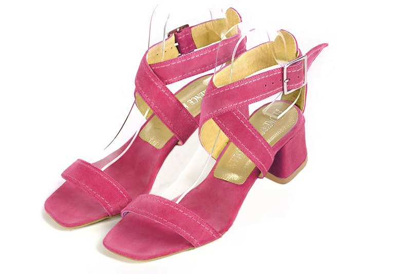 Fuschia pink women's fully open sandals, with crossed straps. Square toe. Low flare heels. Front view - Florence KOOIJMAN